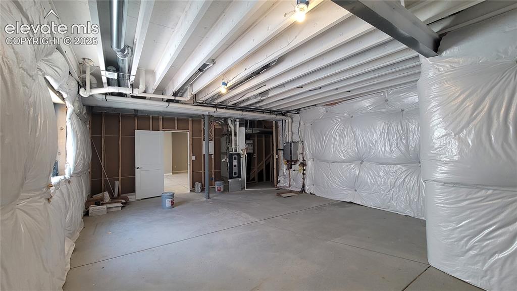 Image 27 of 29: Huge storage room prepped for a future bathroom! 