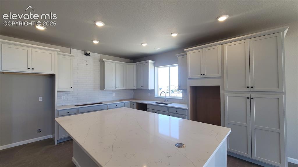 Image 5 of 29: Gourmet Kitchen with Quartz countertops, cabinet pantry, huge island provid