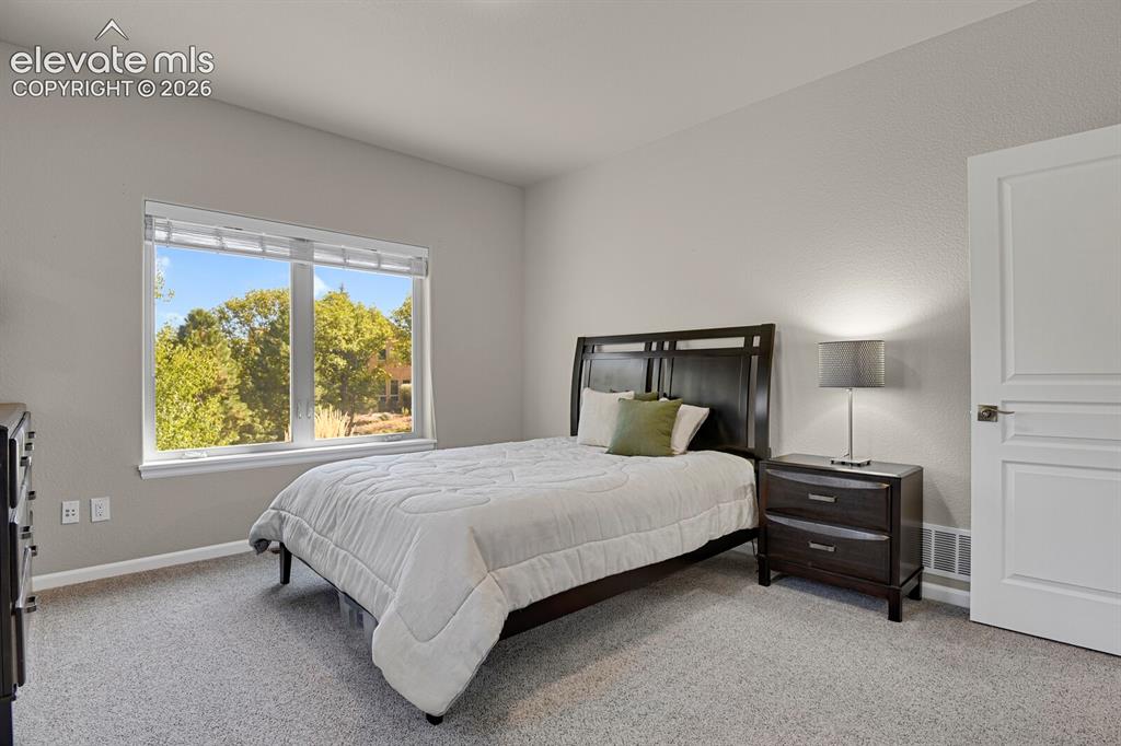 Image 28 of 46: Neutral-toned interior space featuring neutral wall paint, plush carpeting,