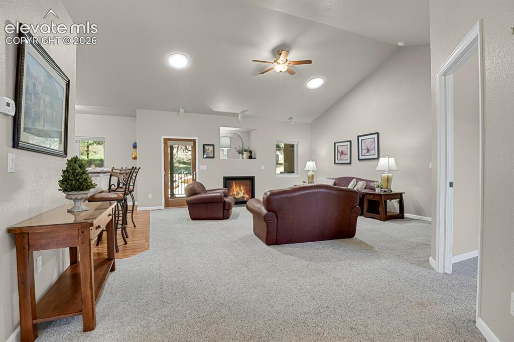 Image 6 of 46: Vaulted ceiling featuring recessed lighting and a ceiling fan, gas fireplac