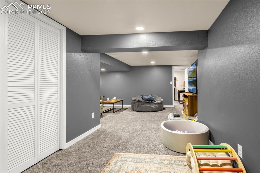 Image 25 of 36: Rec room with carpet floors, baseboards, and recessed lighting