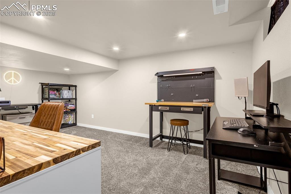 Image 26 of 36: Carpeted office space featuring recessed lighting and baseboards
