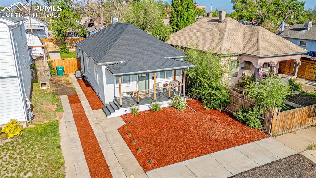 Image 3 of 36: View of front of home featuring roof with shingles, covered porch, a fenced