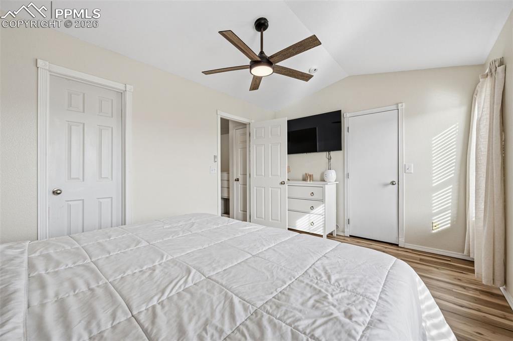 Image 18 of 30: Bedroom featuring a ceiling fan and wood finished floors