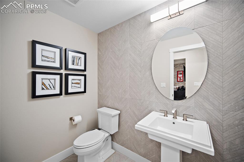 Image 28 of 50: Main level Powder bath.