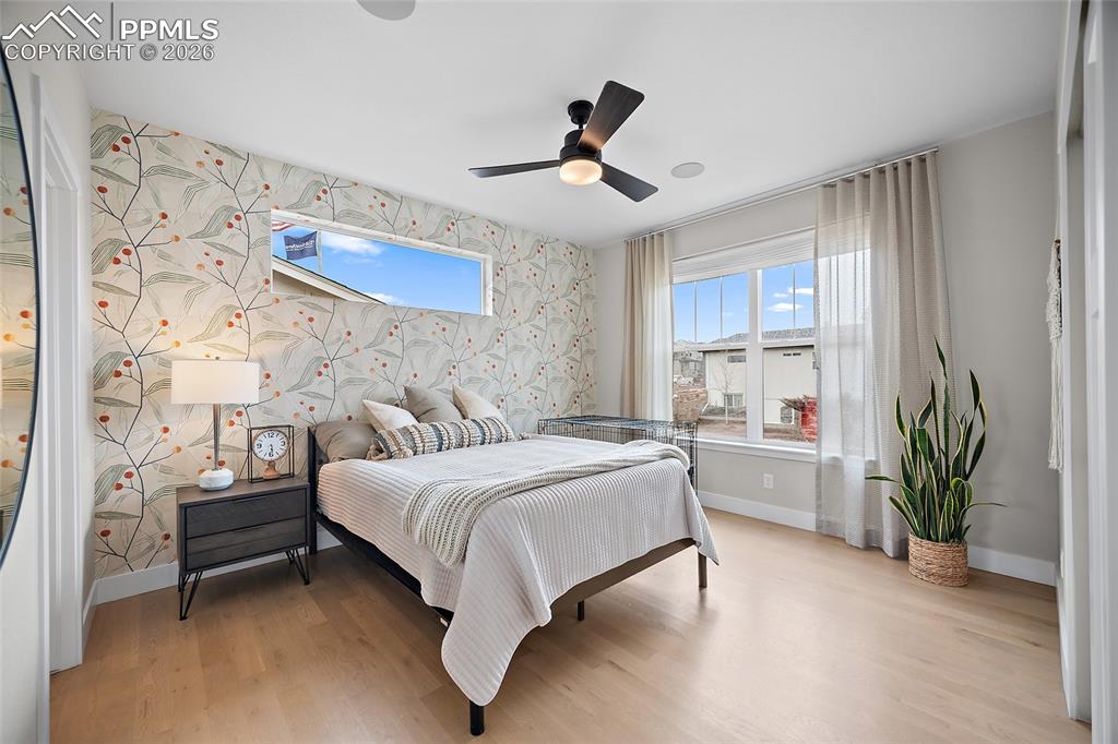 Image 29 of 50: Main level Front bedroom with adjoining bath
