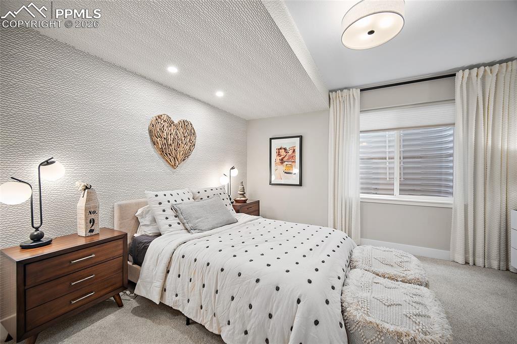 Image 37 of 50: Lower-level bedroom. 