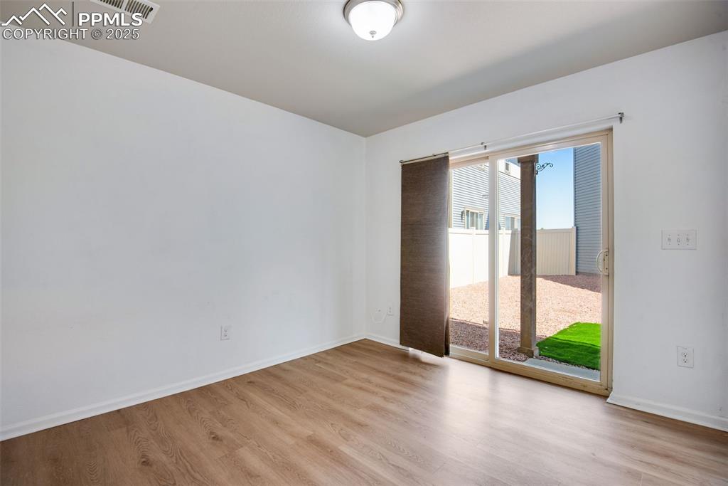 Image 22 of 39: Unfurnished Bonus room with luxury vinyl finished floors and baseboards, wi