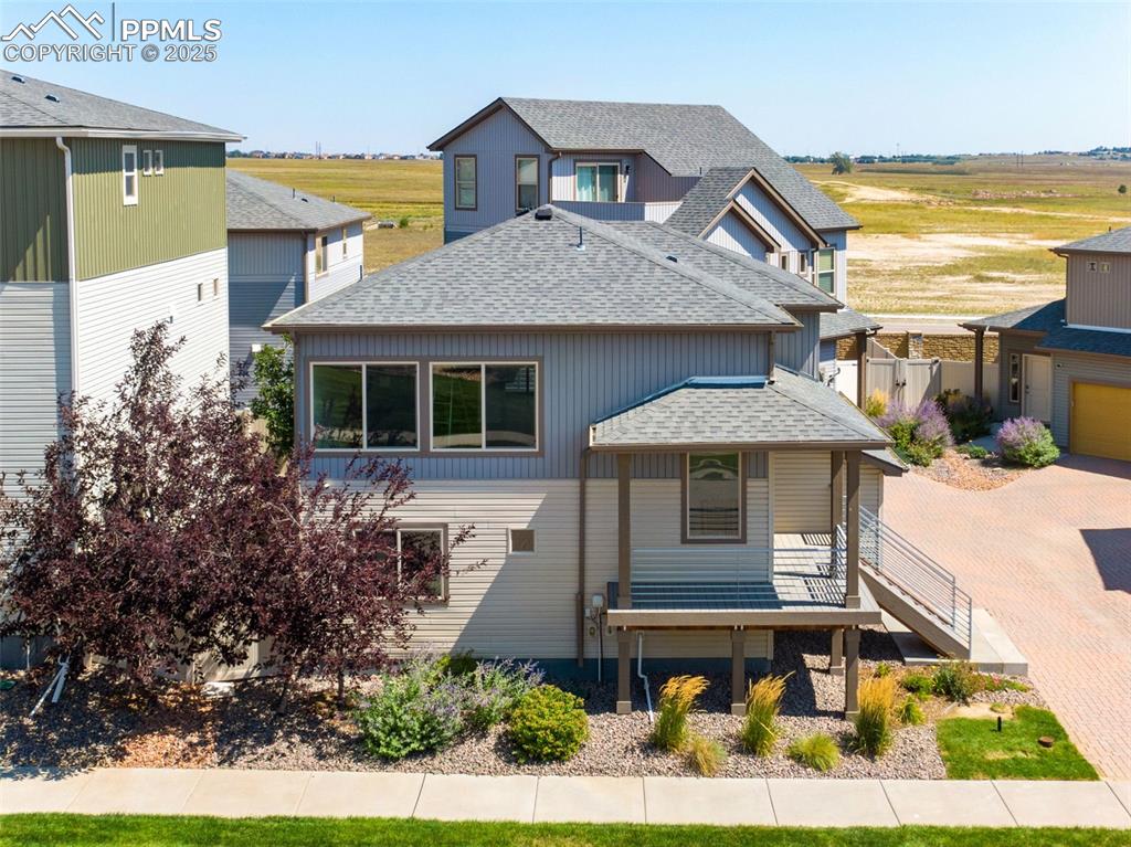 Image 30 of 39: View of front of home featuring a shingled roof