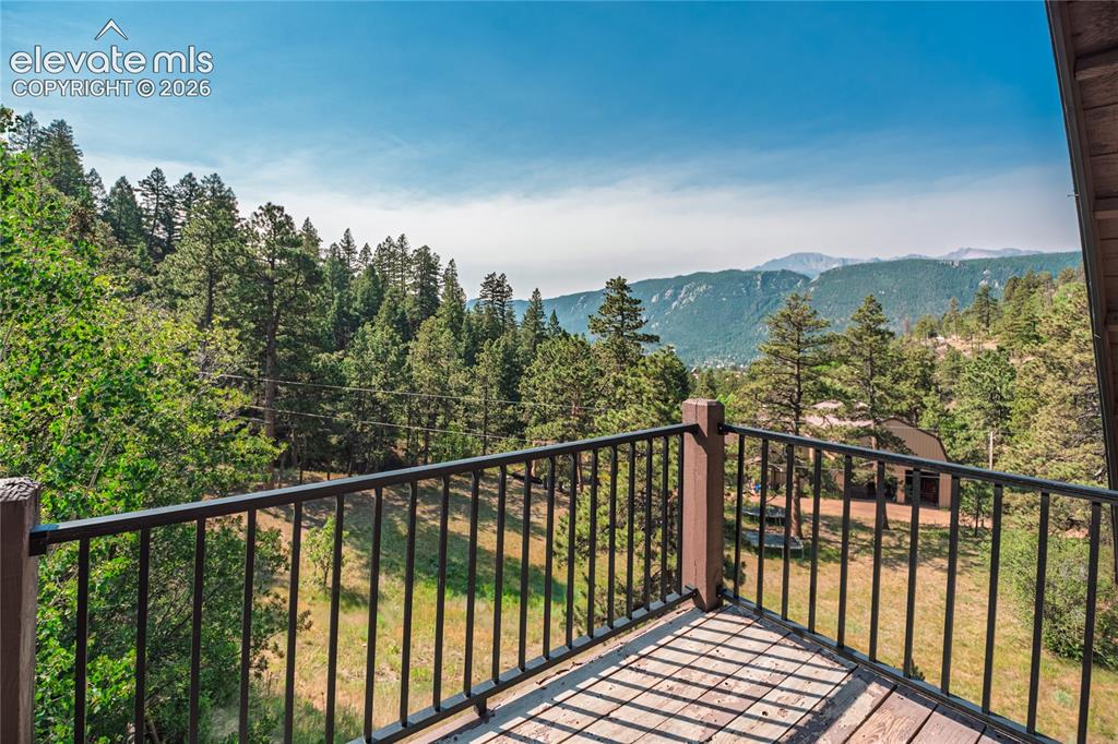 Image 19 of 50: Upstairs balcony view- incredible view of Pikes Peak!