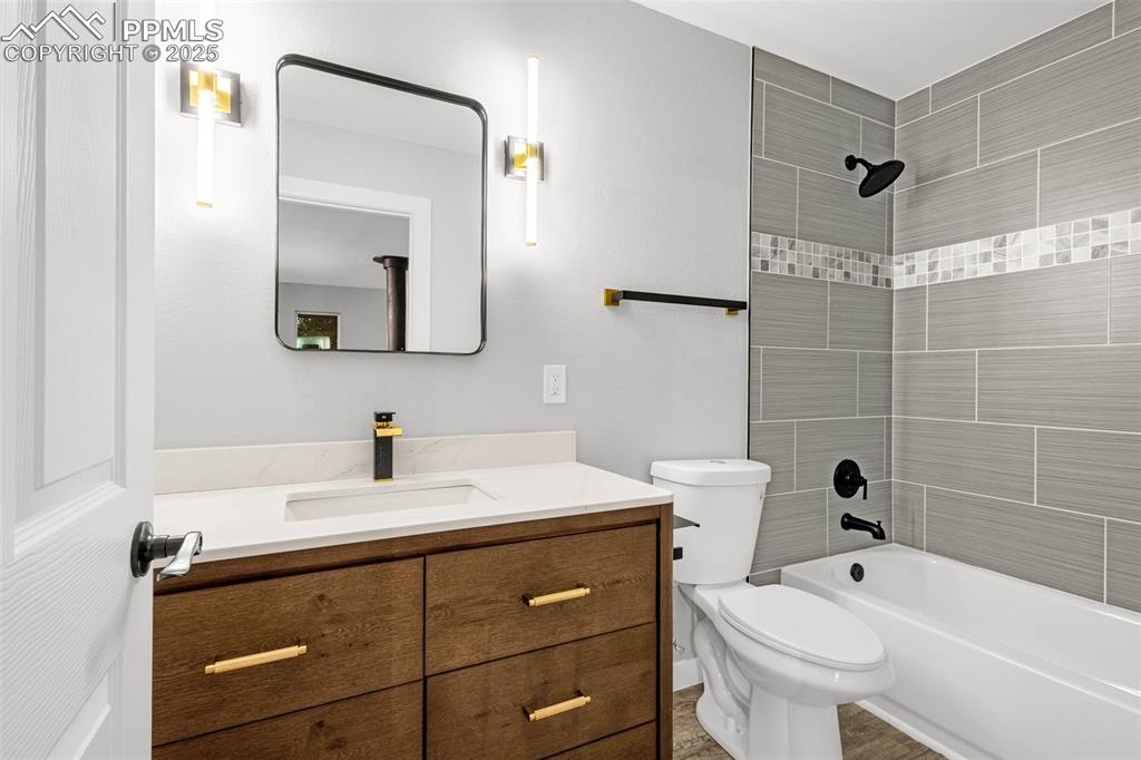 Image 14 of 37: Full bathroom featuring vanity and tub / shower combination