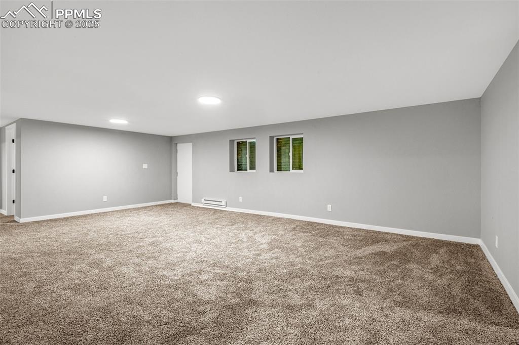 Image 18 of 37: Spare room with carpet floors and recessed lighting