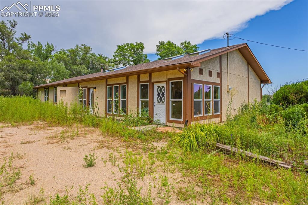 Image 2 of 37: View of front facade with stucco siding