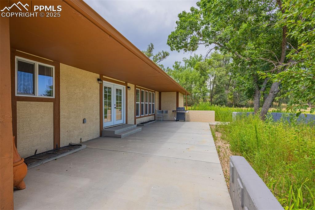 Image 25 of 37: View of patio / terrace with french doors and grilling area