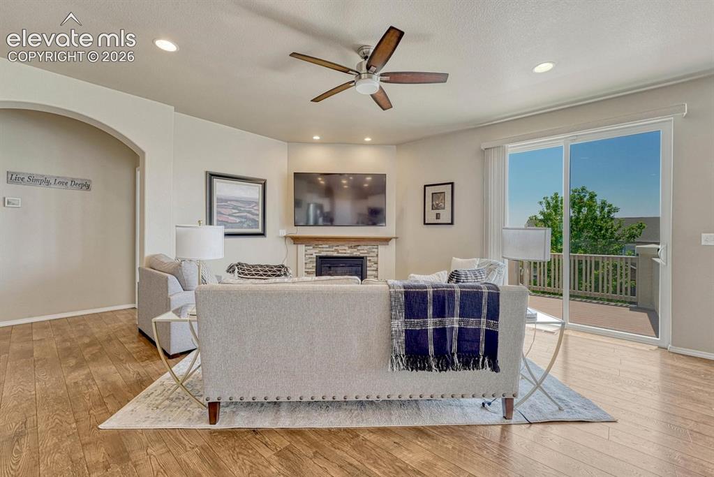Image 15 of 50: The Living Room has a slider to the backyard deck, ideal for outdoor dining