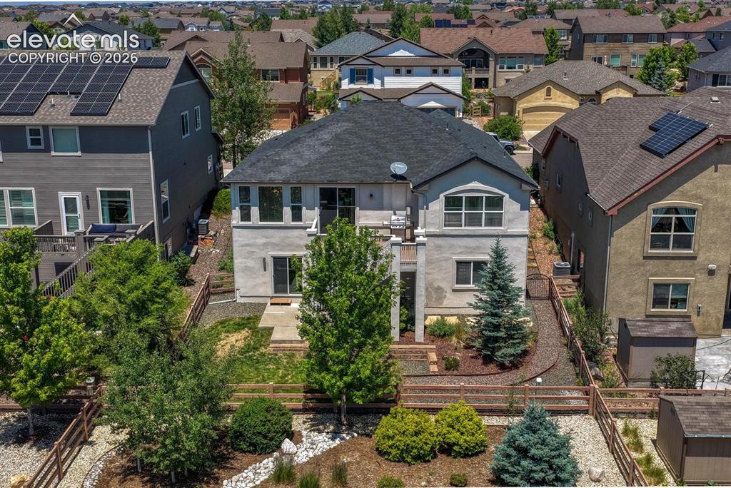 Image 44 of 50: Aerial rear view of home and backyard.