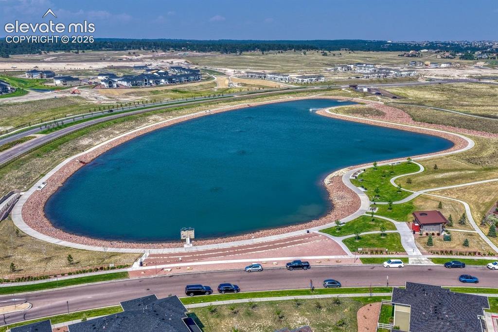 Image 49 of 50: Wolf Lake for seasonal fishing and trails for walking.