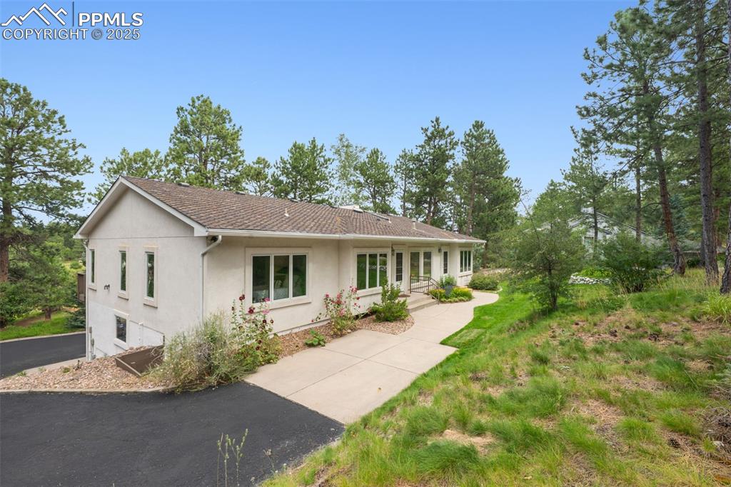 Image 2 of 39: View of front of home with stucco siding