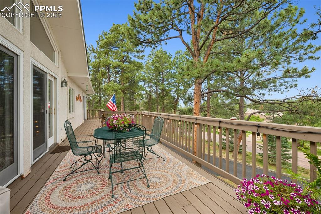 Image 29 of 39: Wooden deck featuring outdoor dining area