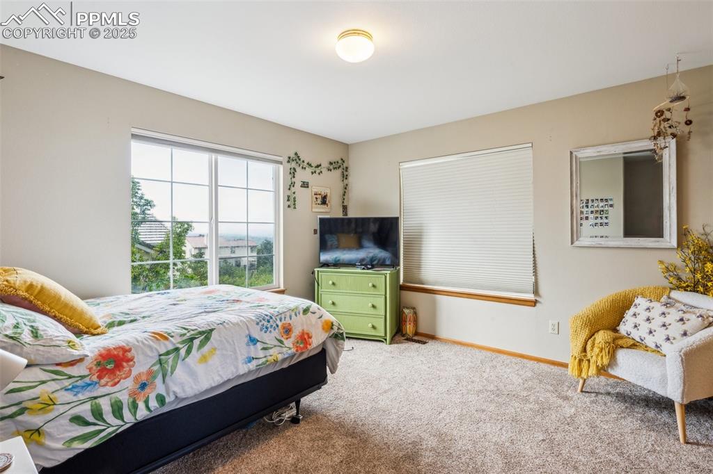 Image 26 of 43: Carpeted bedroom featuring baseboards