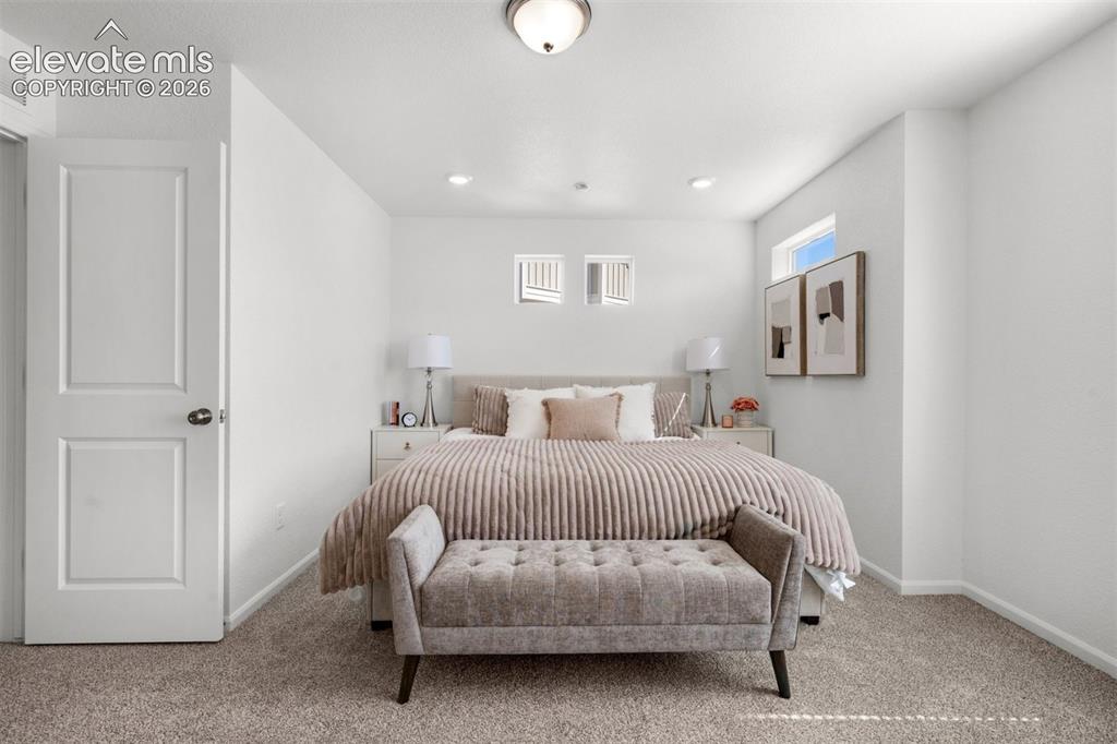 Image 19 of 35: Carpeted flooring, white walls, flush mount ceiling light, recessed lightin