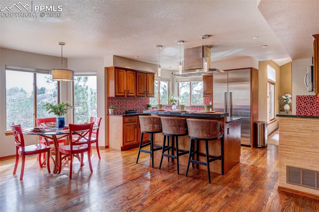 Image 15 of 39: Kitchen and Dining area