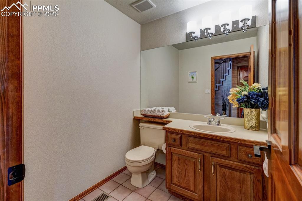 Image 22 of 39: Main level powder room