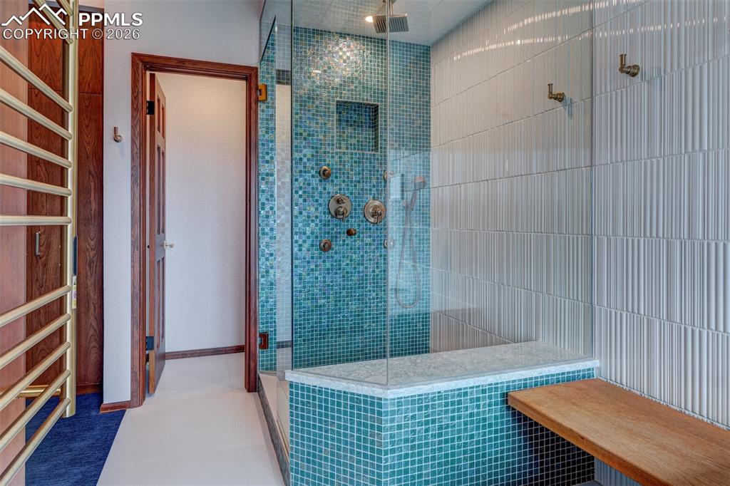 Image 28 of 39: Amazing massage shower with upscale Brizo fixtures. Note: heated towel rack