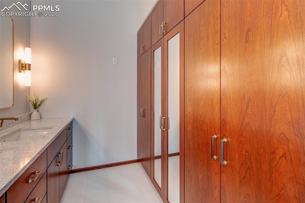 Image 31 of 39: More built ins in the bathroom