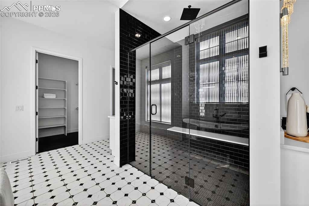 Image 29 of 44: Zero entry walk in shower with bench