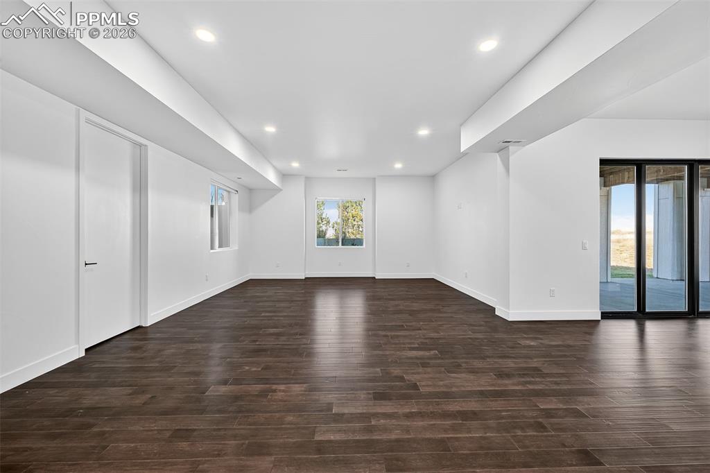 Image 36 of 44: Large basement Rec Room with walk-out