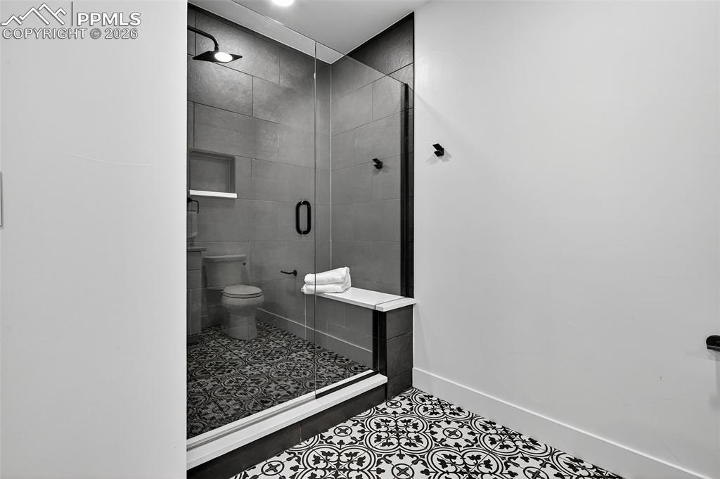 Image 38 of 44: Attached bath with walk in shower