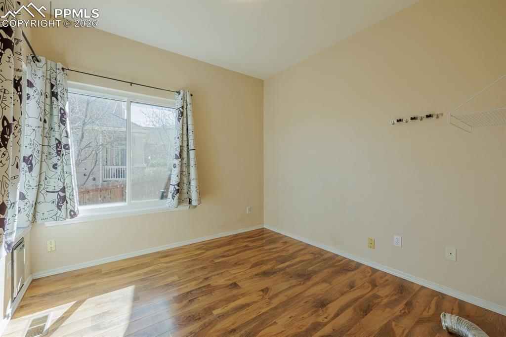 Image 30 of 49: Main Level Bedroom which has been used as a laundry room