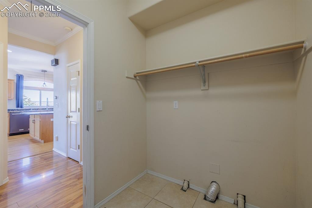 Image 33 of 49: Laundry space in the mud room from the garage