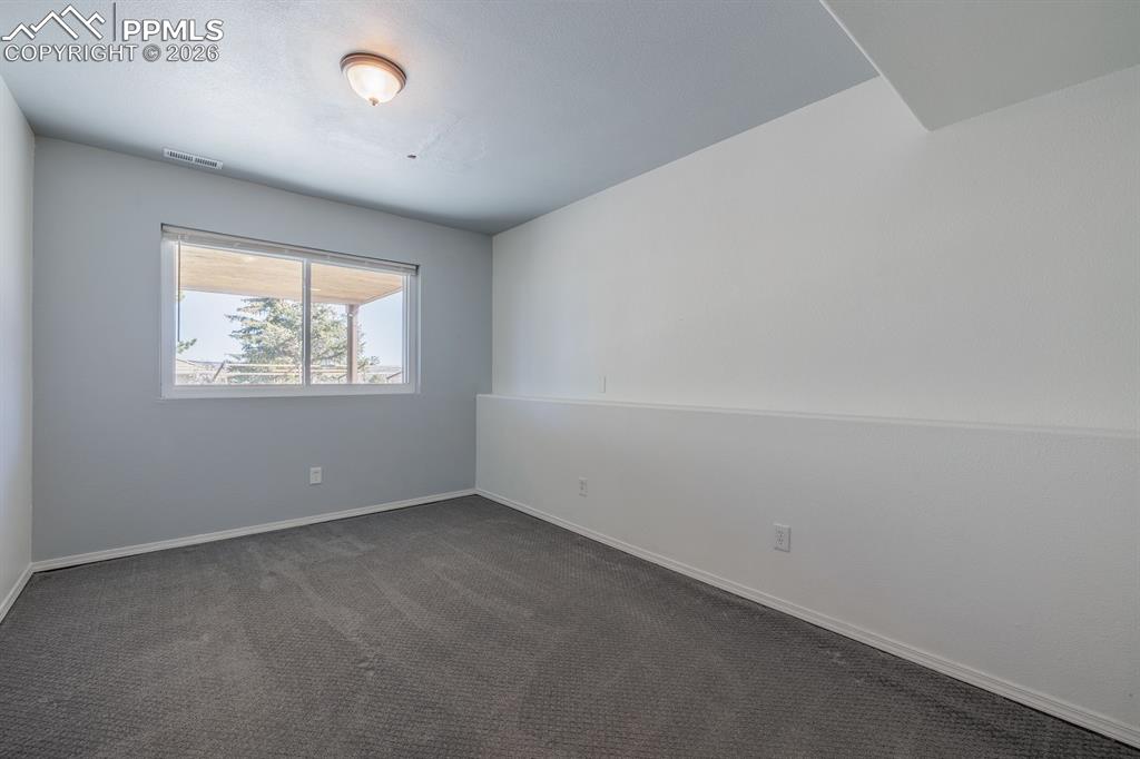 Image 37 of 49: Basement Bedroom