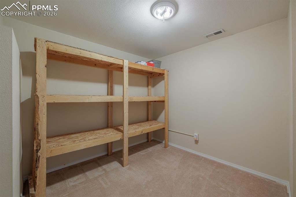 Image 38 of 49: Basement Storage Room