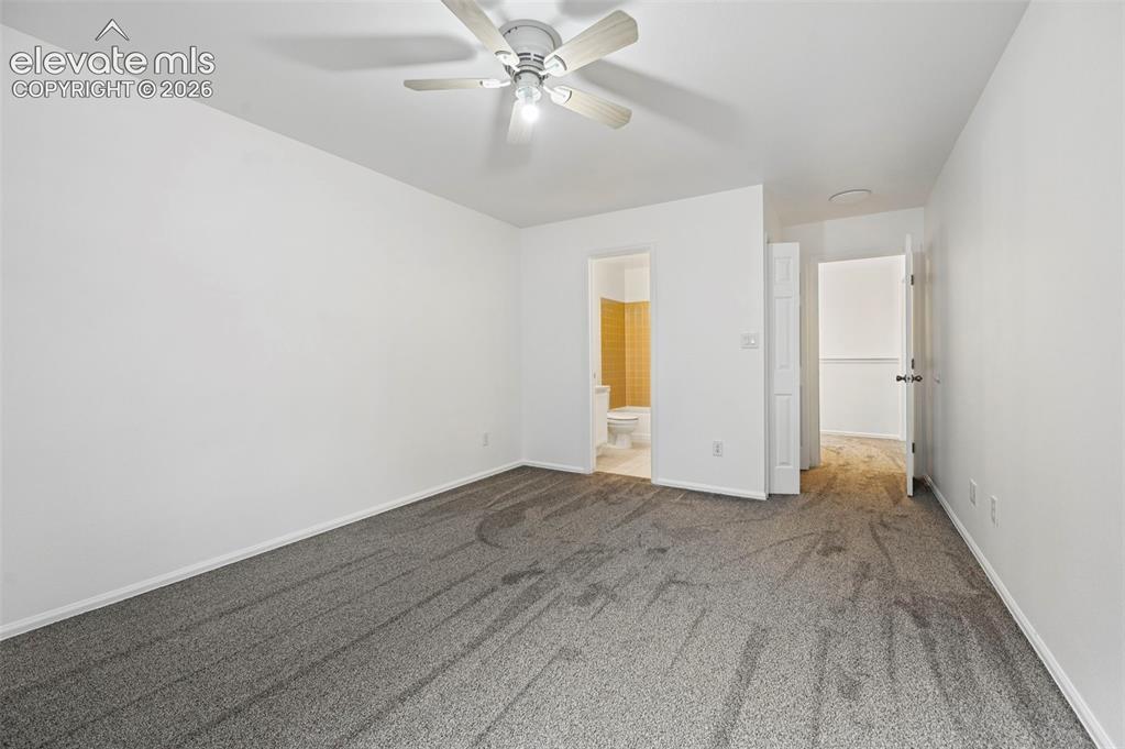 Image 14 of 25: Neutral wall finishes, recessed lighting, and a ceiling fan with light fixt