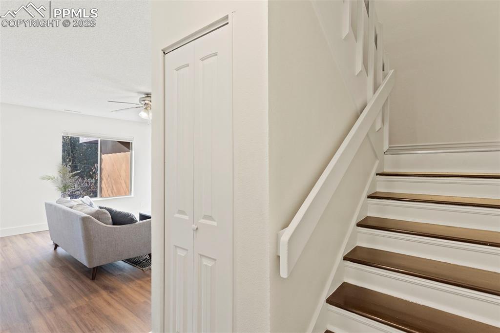 Image 13 of 29: Large closet under stairs for storage. Entry door on main level, as well as