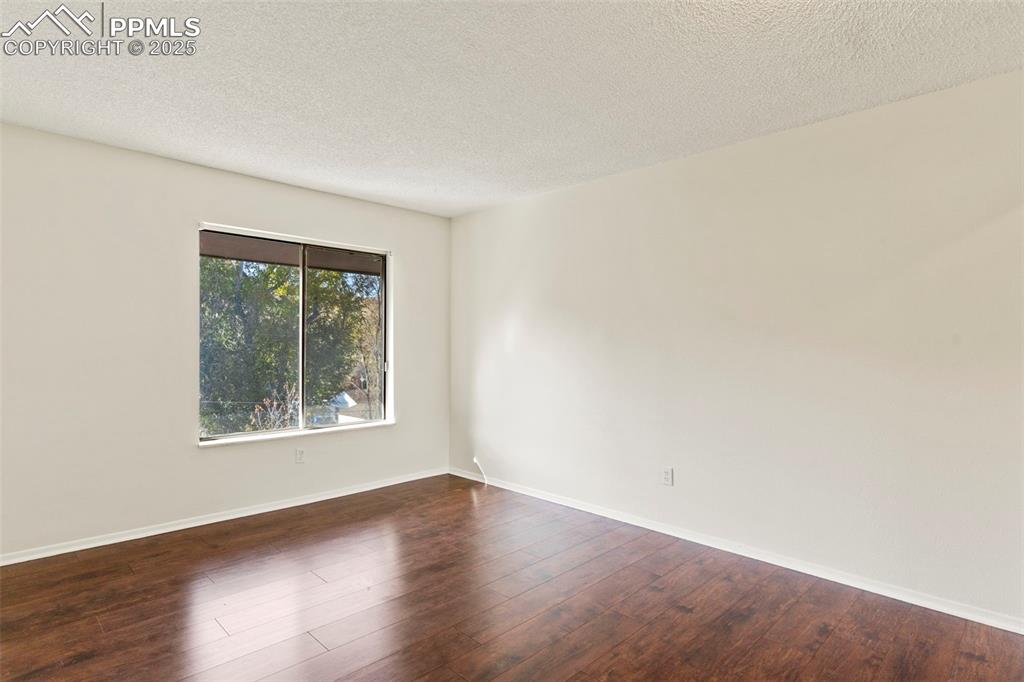 Image 18 of 29: Primary bedroom on upper level with mountain views