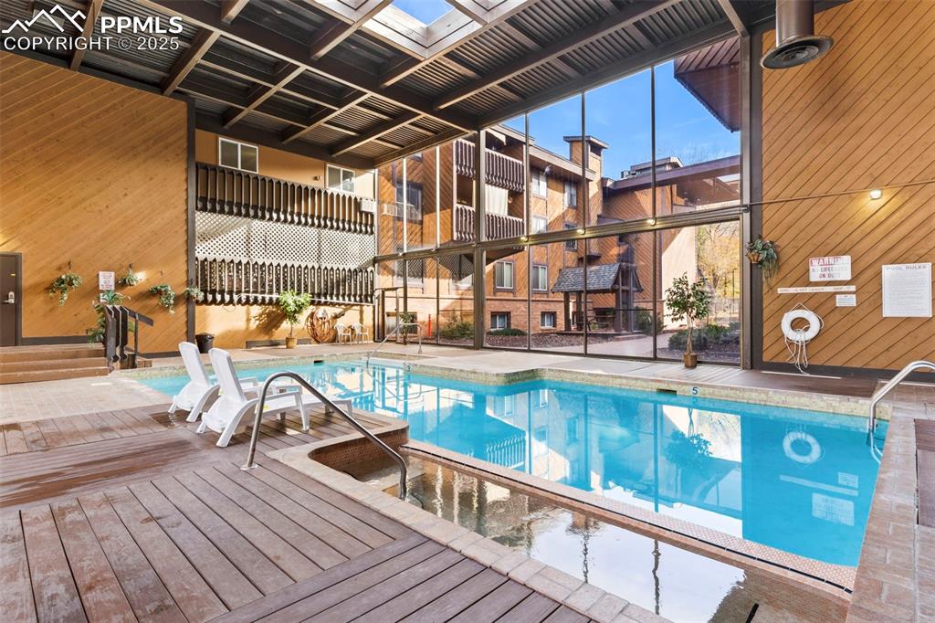 Image 2 of 29: Large indoor community swimming pool