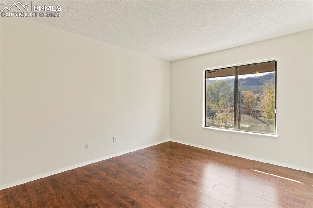 Image 20 of 29: West-facing unit provides mountain views out of nearly every room