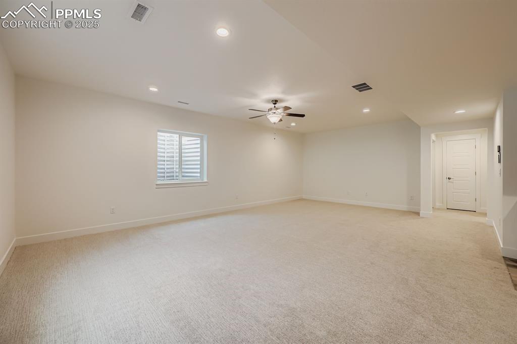Image 22 of 28: Spare room with recessed lighting, light colored carpet, and ceiling fan