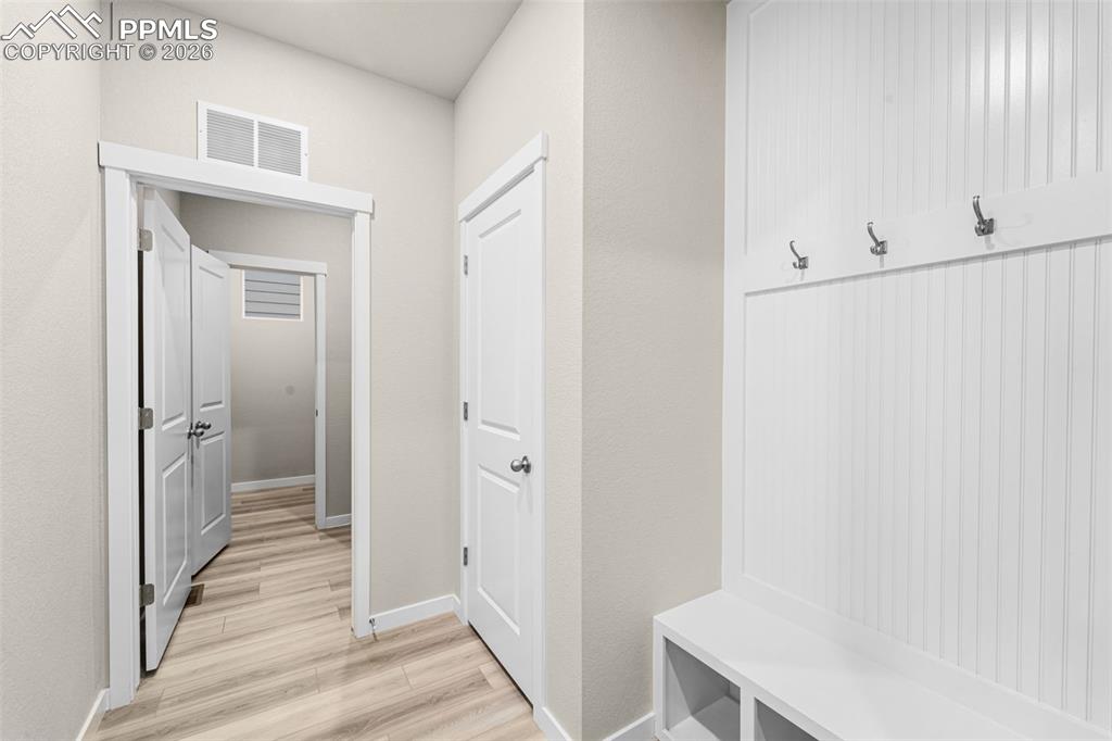 Image 7 of 36: Mud room located at garage door entry