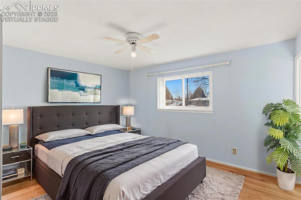 Image 15 of 32: "Virtually Staged"
Primary bedroom with original hardwood flooring