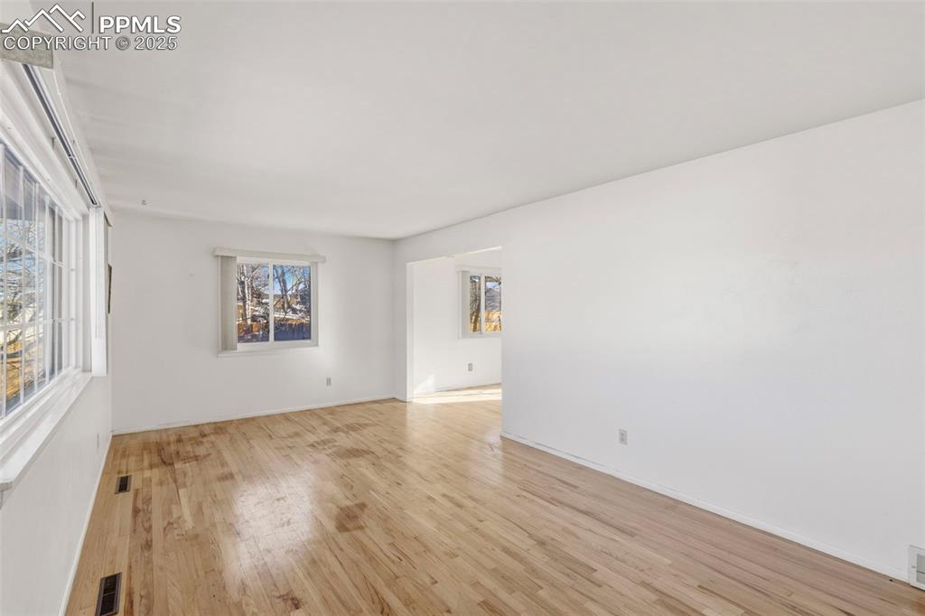 Image 3 of 32: View from the front entry way into the front living room