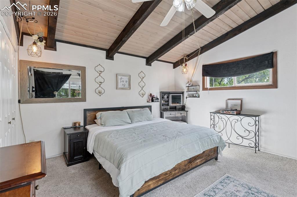 Image 29 of 49: Primary bedroom in the second residence with a functional layout designed f