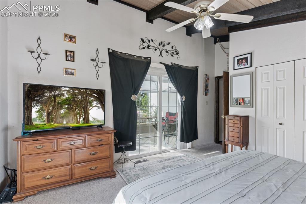 Image 30 of 49: Sliding glass doors to the deck