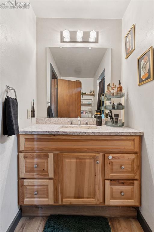Image 31 of 49: Full bathroom with updated vanity and fixtures; includes a tub/shower combi