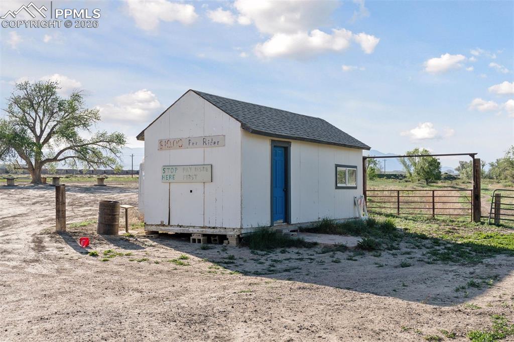 Image 35 of 49: Dedicated trailhead shed serving as the entry point to the on-site motocros