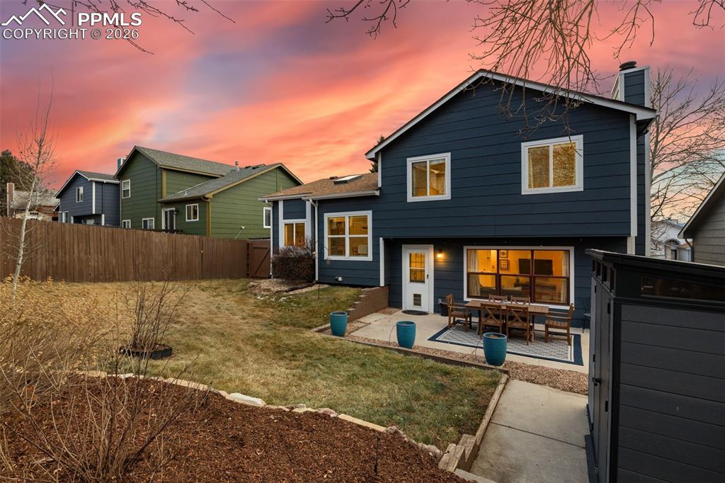 Image 39 of 41: Fully landscaped with wonderful patio and large and modern shed.